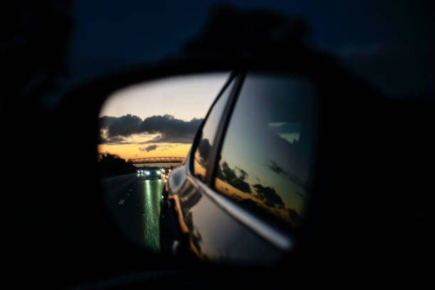 istock reflection of the evening highway in the side mirror 1832458446
