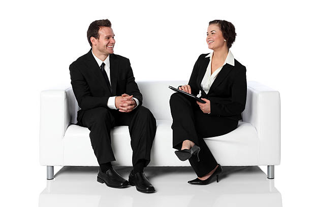 Businesswoman interviewing man on a couchhttp://www.twodozendesign.info/i/1.png