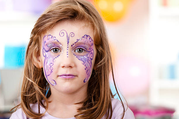 istock Little girl with butterfly face paint 183246356