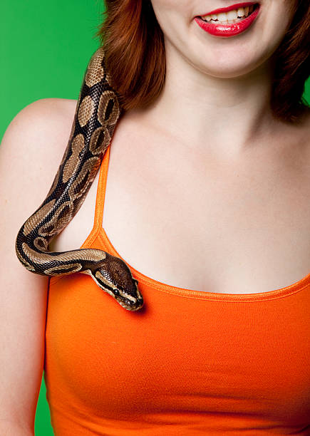 istock snake crawling down teenage girl 183246362