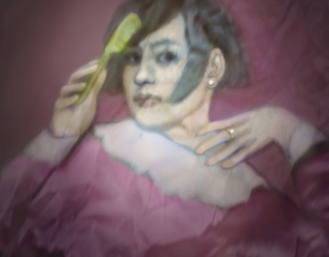 Photo of crumpled paper in the shape of a woman combing her hair