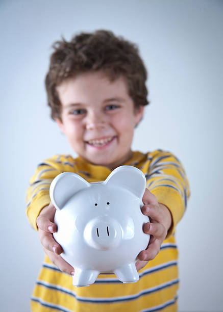 istock Child Piggy Bank 183246749
