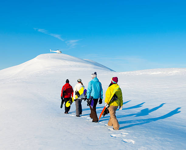 istock Heli Ski winter Snowboarders. 183246823