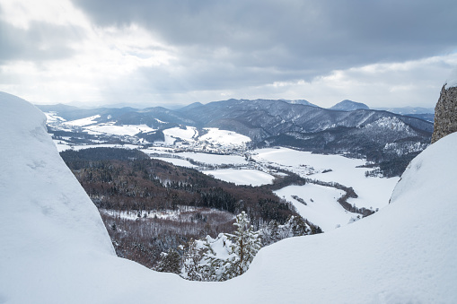 Snowy winter landscape with rocky mountain range. National Nature Reserve Sulov Rocks, Slovakia, Europe.