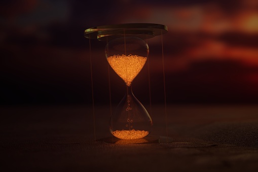 In the vast desert, an hourglass flows with sand, painting a tranquil picture of time amid the shifting sands.3D rendering.