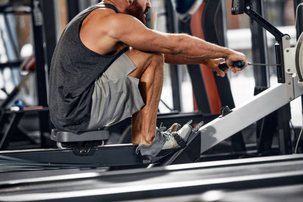 Training legs in the simulator, the athlete works with his legs on the simulator, working out the muscles on the legs