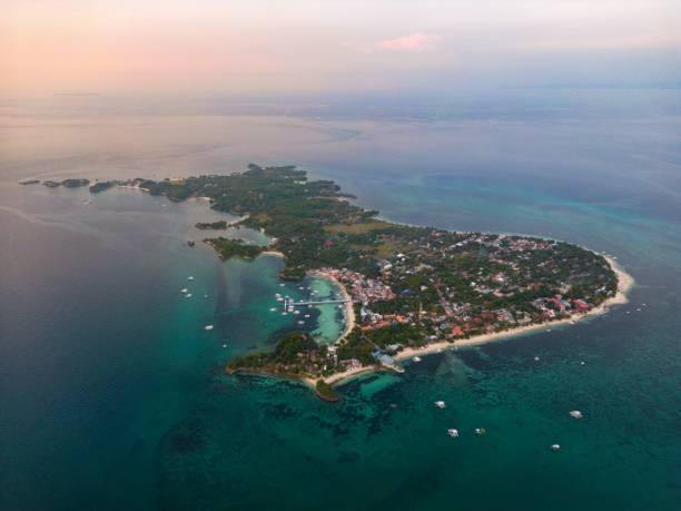istock a small island with several white houses and several ages: Mapascua Island, Philippines 1832478055
