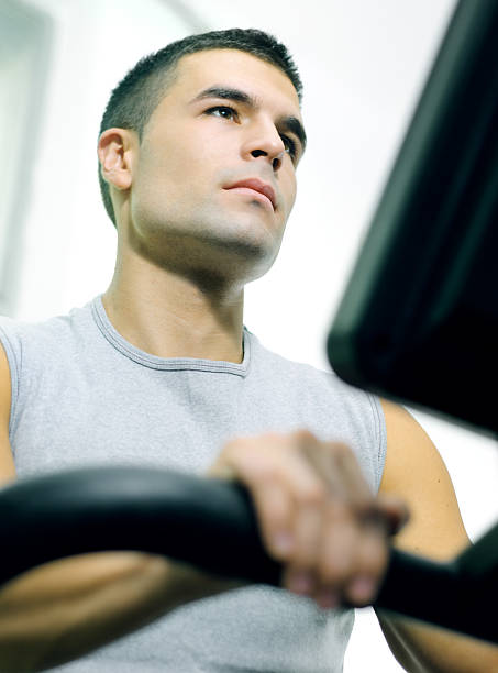 Man in gym Handsome man at the gym doing exercises. georgijevic stock pictures, royalty-free photos & images