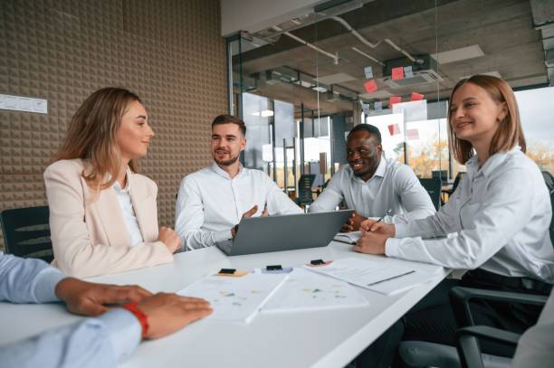 Free Stock Photo of Group of People Sitting at Tables in Front of ...