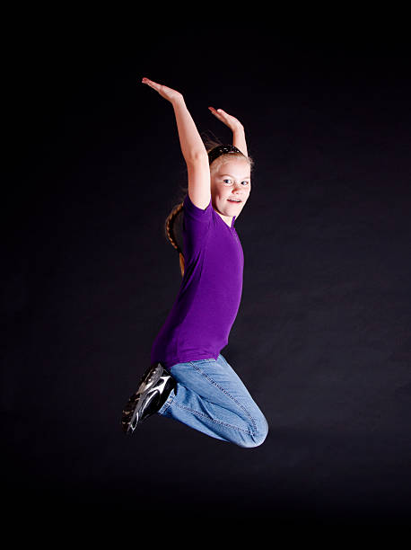 istock Happy Young Girl Jumping 183248690