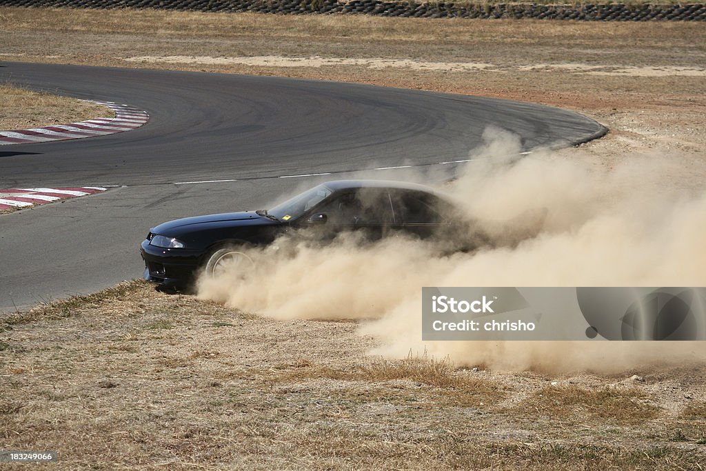 Nissan R33 GTR losing control on racetrack [4/4] Image 4 of a sequence of action images showing a modified R33 Skyline GTR losing control and spinning out onto the gravel.Image 4 out of 4. Car Stock Photo