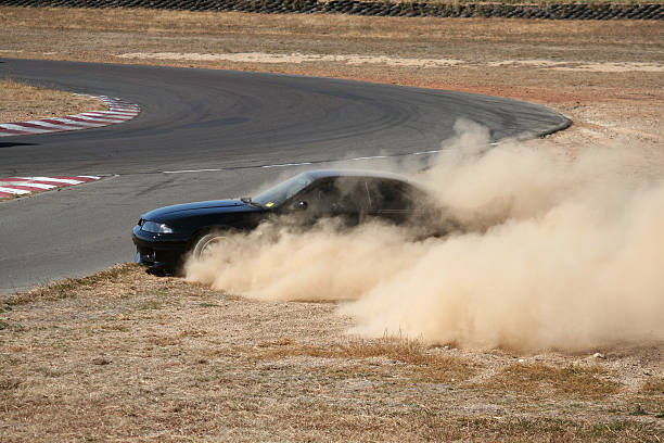 Nissan R33 GTR losing control on racetrack [4/4] stock photo