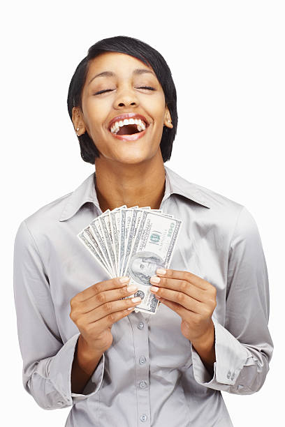 mujer de negocios joven feliz sosteniendo billetes contra blanco - laughing women us paper currency isolated fotografías e imágenes de stock