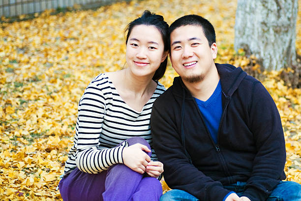 istock Young asian couple in the park 183250195