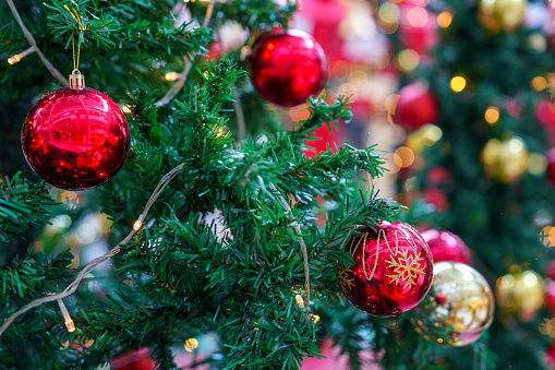 Christmas lights on Christmas tree, decorative garland in dark space