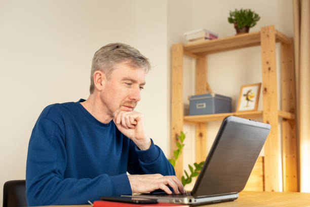istock 50 year old male freelancer working in home office 1832504014