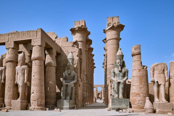 istock two large statues and one small statue in the distance with one standing in front 1832504638