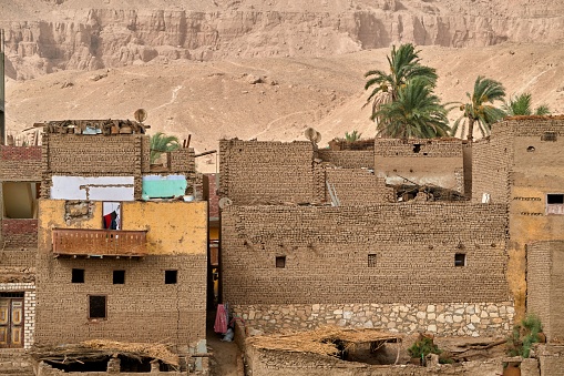 The African folk architecture with houses made of straw, mud, and stone near the desert in Egypt.