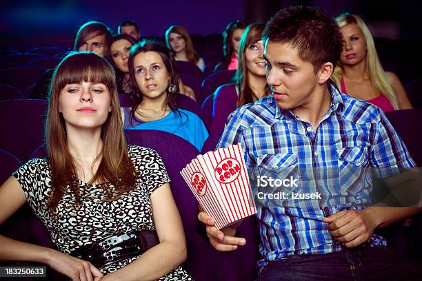 Teen Couple In Movie Theater Stock Photo - Download Image Now - Movie Theater, Displeased, Movie