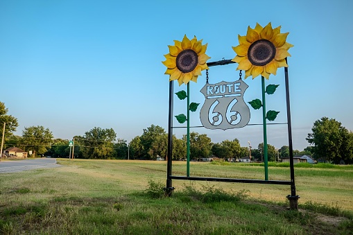 A Street sign on historic Route 66 against the sun