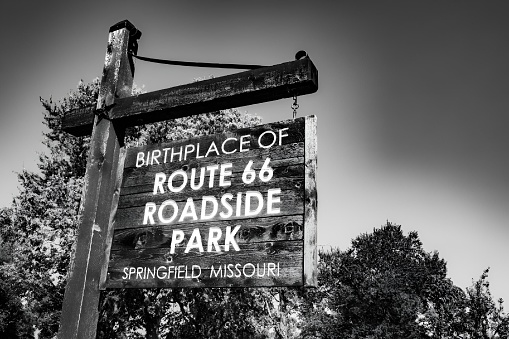 A Street sign on historic Route 66 against the sun