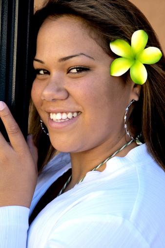 A Polynesian beauty with a hibiscus flower in her hair.