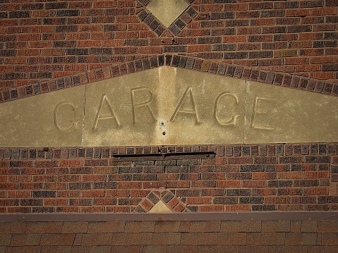 A building with the word 'Garage' in bold lettering against the wall