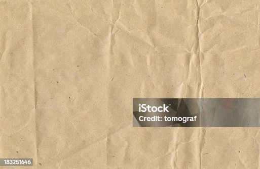 istock Crinkled brown paper 183251646