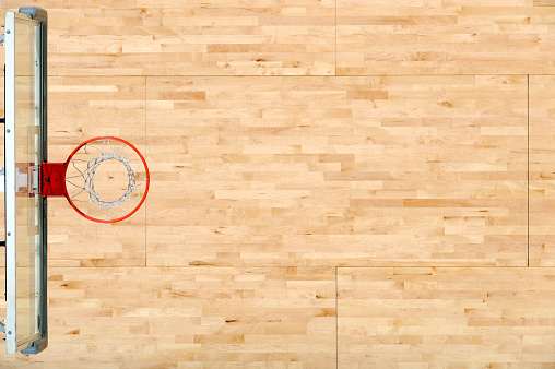An aerial view of a basket rim and the floor