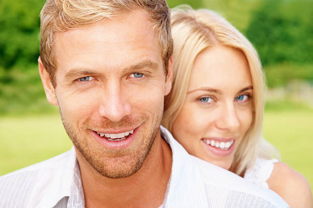 istock Smart middle aged man being hugged by young woman 183251736