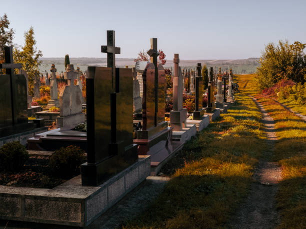 istock Modern cemetery with graves and crosses. 1832520934