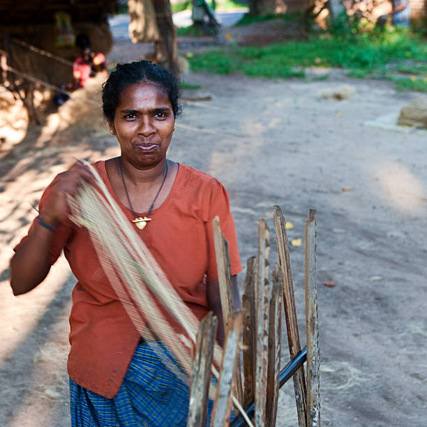 istock Women weaving a rope 183252330