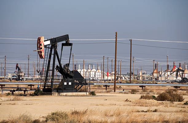 istock Pump jacks in oil field 183252557