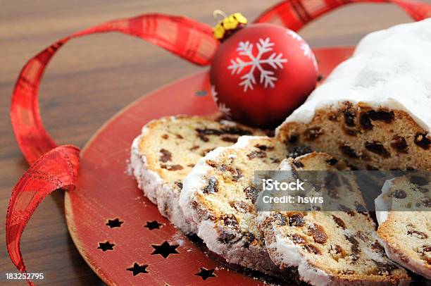 Christstollen On Red Plate With Star Shape Ornaments Stollen Stock Photo - Download Image Now