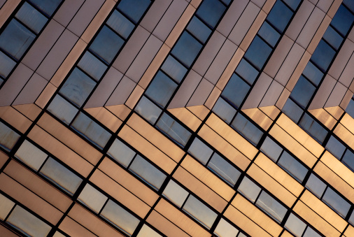 Modern office building reflecting sunshine.View more related images in one of the following lightboxes:
