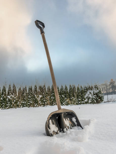 istock Snow clearing shovel driven into thick snow cover 1832538977