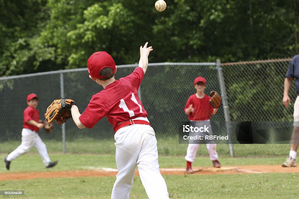 Play at First a little league play at first Baseball - Sport Stock Photo