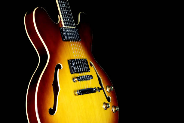 istock Semi Acoustic Electric Guitar Isolated Against a Black Background 1832549687