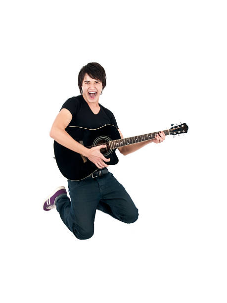 istock A guitarist jumping in the air 183255191