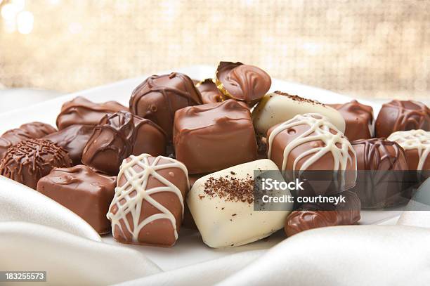 Chocolate Collection On A Silk Ackground Stock Photo - Download Image Now - Chocolate, Candy, Sweet Food