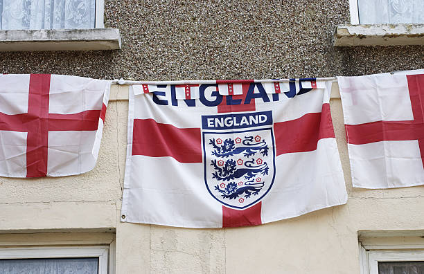 Soccer ball on england flag background with copy space