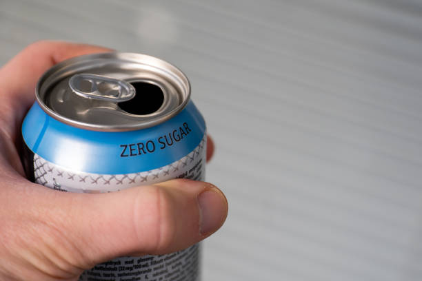 hand holding a zero sugar soda can hand holding a zero sugar soda can. diet soda concept. coke zero photos stock pictures, royalty-free photos & images