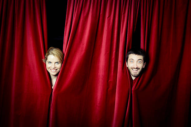 Actors on stage Actors on stage peeking through the curtain.About 35 more file on this theme & series cliking on any photo: pantomime dame stock pictures, royalty-free photos & images