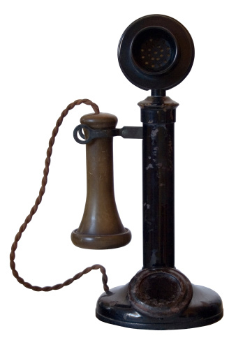Original well used antique telephone with scratches rust &  flaking paint, isolated on white with clipping path