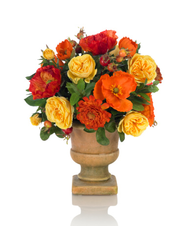 Florist holding Bouquet of Roses in Orange color. close up.