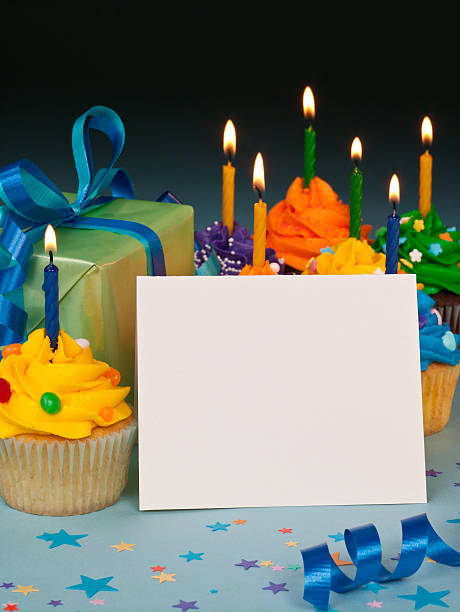 Celebration cupcakes with blank card stock photo