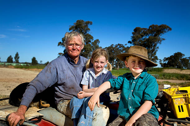 Man with his son and daughter in the country stock photo