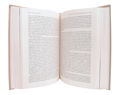 Book open with inside visible. Book is sharp but text is deliberately blurred so you cannot read it. Clipping path included.