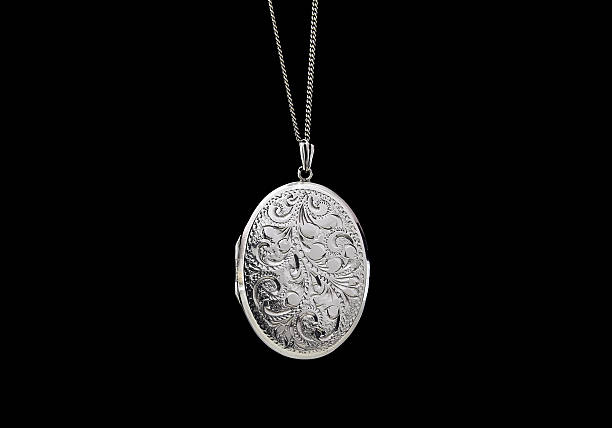 Locket Antique silver locket on black background locket stock pictures, royalty-free photos & images