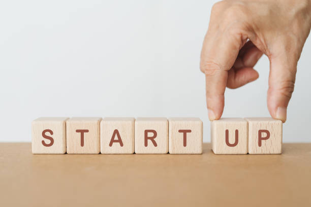 istock hand completed start up word on wooden cube block for business start up concept 1832568307